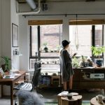 Small Apartment Organization - woman standing near brown wooden cabinet