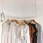 Linen Closet Organization - assorted clothes in wooden hangers