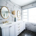 Budget Bathroom Update - a bathroom with two sinks and a large mirror