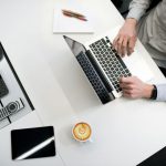 Flooring On A Budget - person using laptop on white wooden table