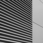 HVAC Maintenance - a black and white photo of the side of a building