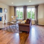 Hardwood Floors - a living room filled with furniture and a fire place