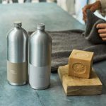 Natural Cleaners - a couple of metal containers with metal objects on a table