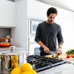 Kitchen Aprons - man cutting vegetables