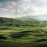 Energy Saving - wind turbine surrounded by grass