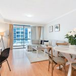 Open Plan Living - a living room filled with furniture and a dining room table