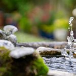 Water Feature - water falling from brown wooden log