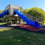 Playground Equipment - a playground with a slide and a play structure