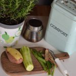 Composting System - green plant on white and purple floral ceramic pot