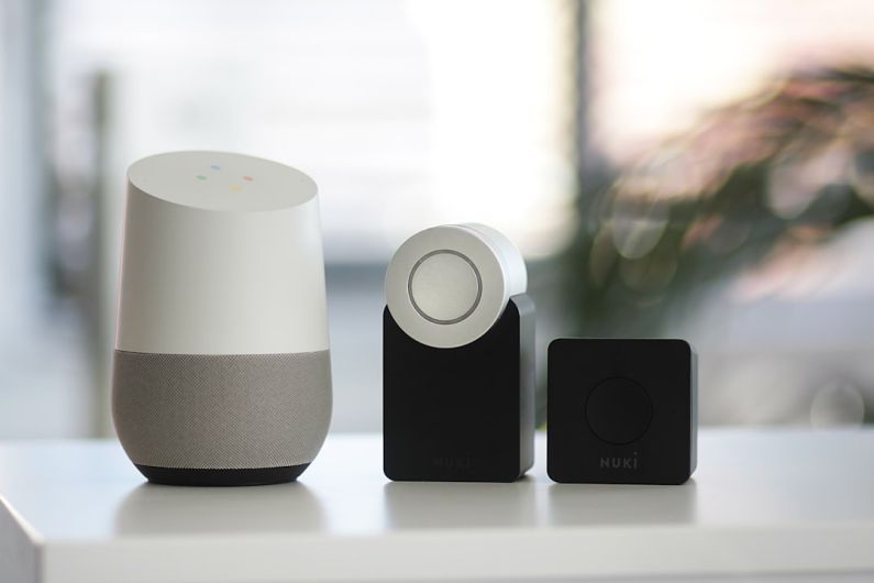 Smart Home - white and gray Google smart speaker and two black speakers