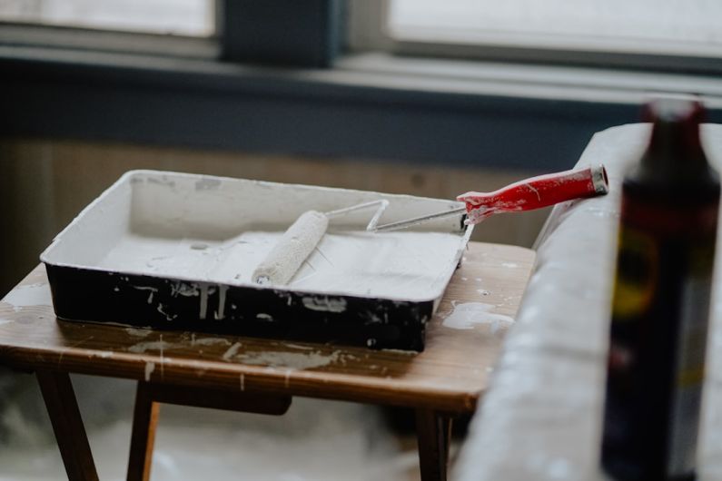 Renovation - black and white box on brown wooden table