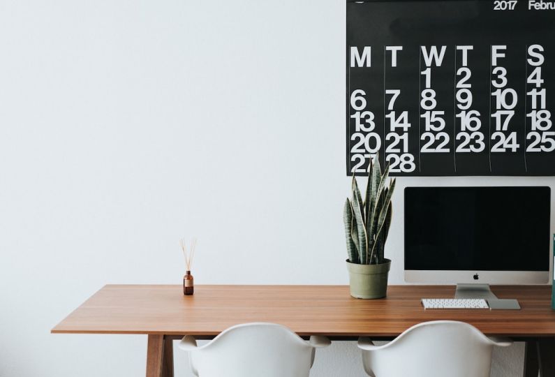 Project Home - silver iMac on brown wooden desk