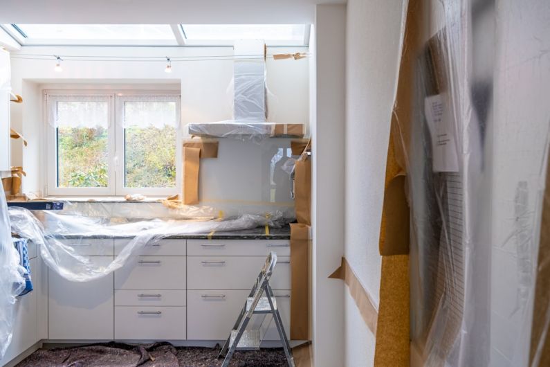 Renovation - white wooden cabinet near window